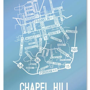 May include: A blue and white map of Chapel Hill, North Carolina, with street names and numbers. The map is on a blue background with a white border.