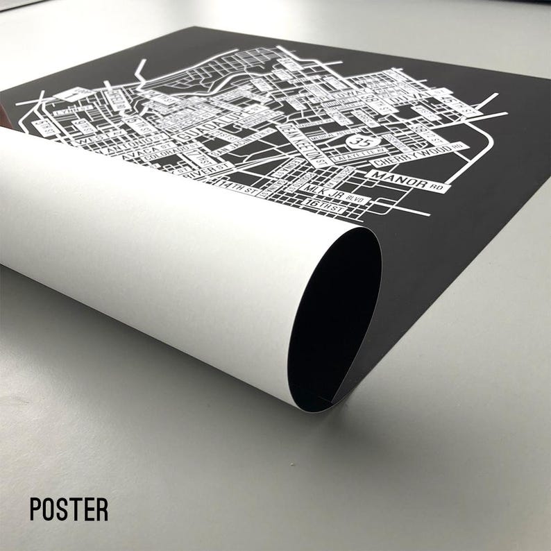May include: A black and white poster with a map of a city. The map shows street names and landmarks. The poster is rolled up and has the word "POSTER" printed on the bottom.
