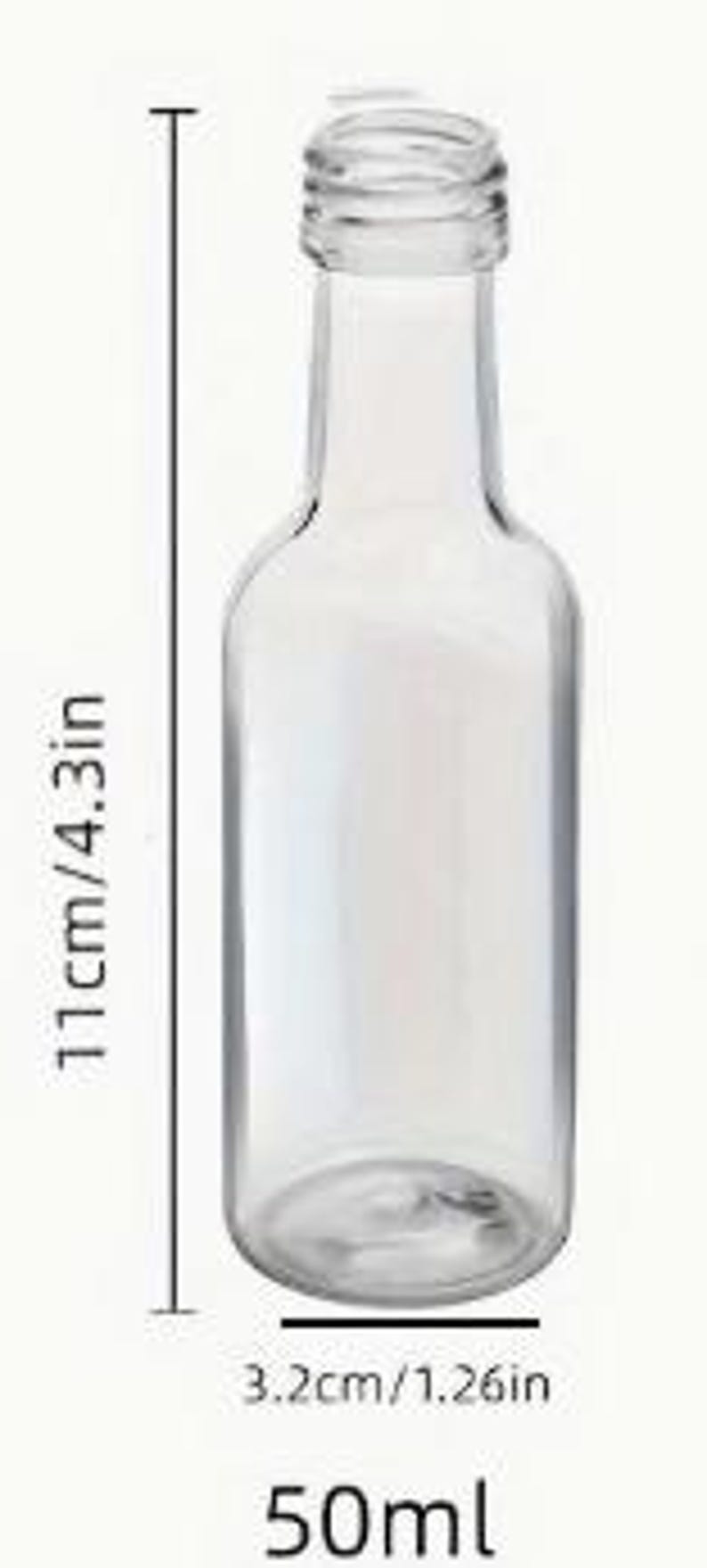 May include: A transparent glass bottle with a narrow neck and a rounded body. The bottle is 11cm tall and 3.2cm wide. The bottle has a 50ml capacity. The bottle is empty and ready to be filled.