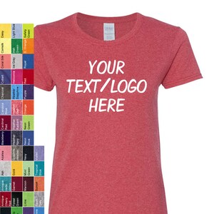 May include: A heather red short-sleeve t-shirt with the white text YOUR TEXT/LOGO HERE printed on the chest. To the left, a vertical color chart displays various fabric color options with their corresponding names in small black text.
