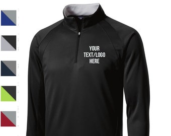 May include: Black quarter-zip pullover with a white embroidered logo that says "YOUR TEXT/LOGO HERE".