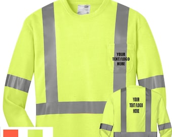 May include: A long-sleeved safety shirt with reflective tape in a bright yellow color. The shirt has a pocket on the left chest with the text "YOUR TEXT/LOGO HERE".