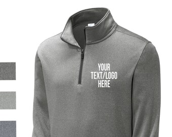 May include: A heather gray 1/4 zip pullover sweatshirt with a white embroidered logo that says "YOUR TEXT/LOGO HERE".
