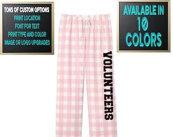 May include: Pink and white checkered pajama pants with the word "VOLUNTEERS" printed vertically on the left leg. The pants have a drawstring waist. Text on the left says "TONS OF CUSTOM OPTIONS". Text on the right says "AVAILABLE IN 10 COLORS".