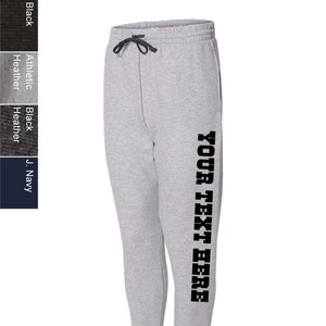 May include: Gray sweatpants with a black print that says "YOUR TEXT HERE" down the side of the right leg.