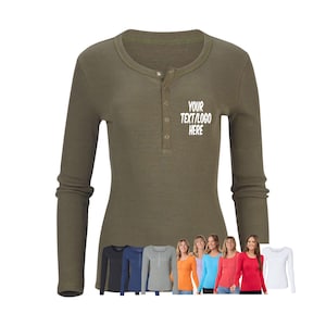 May include: A long-sleeved, olive green, ribbed thermal shirt with a button placket and a white text design that says "YOUR TEXT/LOGO HERE". The shirt is shown on a white background with a row of women wearing the same shirt in different colors.