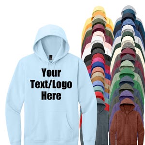 May include: A light blue hoodie with the text "Your Text/Logo Here" in black. The image shows a variety of hoodies in different colors, including yellow, red, green, and brown. The hoodies have a hood and a front pocket.