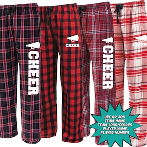 May include: Three pairs of red and black plaid pajama pants with a white "CHEER" graphic and a megaphone design. The text "USE OR ADD TEAM NAME TEAM LOGO/COLORS PLAYER NAME PLAYER NUMBER" is visible in the bottom right corner.