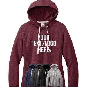 May include: Burgundy heather hoodie with a white drawstring and the text "YOUR TEXT/LOGO HERE" printed on the front. The hoodie is shown with five different color options: navy blue, black, heather grey, dark heather grey, and white.