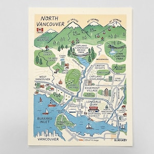 May include: A cream-colored illustrated map of North Vancouver featuring green mountains, blue water, and various landmarks like Capilano Suspension Bridge Park, Lonsdale Quay, and Burrard Inlet. The map includes text labels for locations and roads.