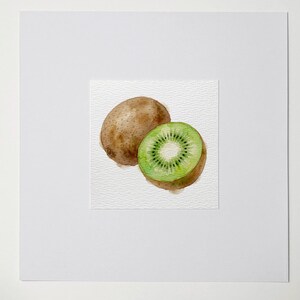 May include: Watercolor painting of a whole kiwi and a kiwi cut in half, revealing the green flesh and black seeds. The whole kiwi is brown and fuzzy. The painting is on a textured white paper.