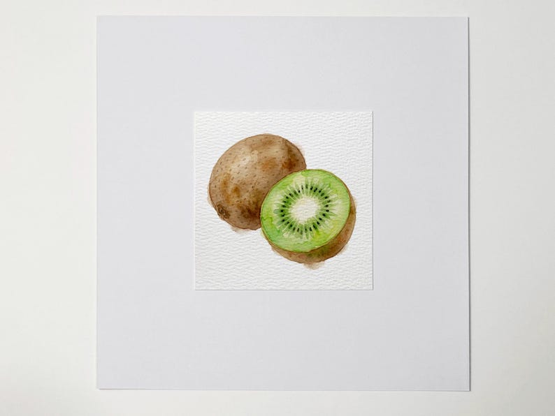 May include: Watercolor painting of a whole kiwi and a kiwi cut in half, revealing the green flesh and black seeds. The whole kiwi is brown and fuzzy. The painting is on a textured white paper.
