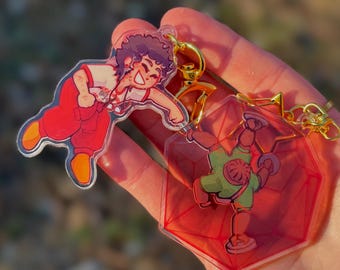 Punho no meu peito — Não é assim que se chama Magnéticos Charms VERSÃO EM LIVRO