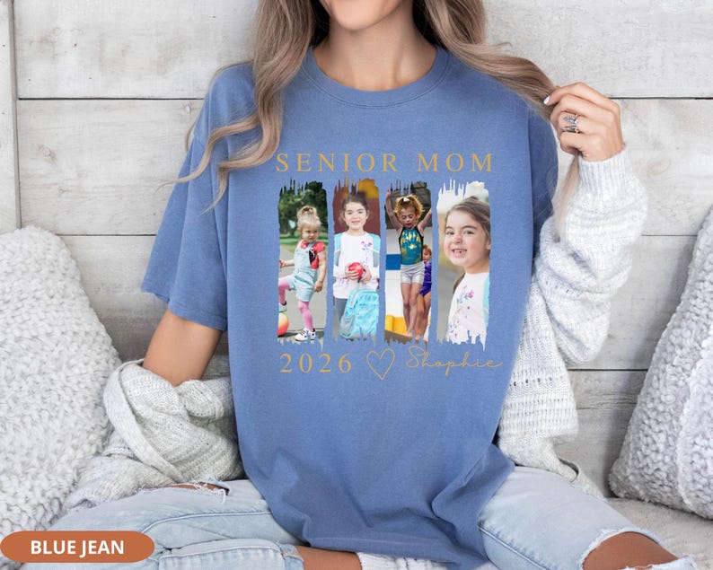 May include: Blue jean colored t-shirt with the words "SENIOR MOM" in gold lettering above a collage of four photos. Below the photos are the numbers "2026", a heart, and the name "Sophie" in gold script.