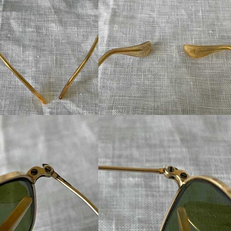 May include: Close-up of gold-rimmed sunglasses with green lenses. The image shows the details of the frame, including the hinges and the temple arms. The sunglasses are set against a neutral background.