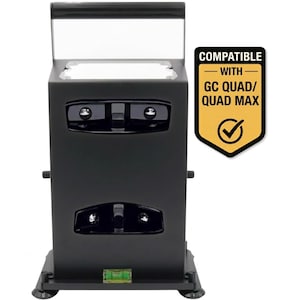 May include: A black rectangular device with a handle and a clear top. The device has two sets of circular lenses and a level. A yellow and black label reads "COMPATIBLE WITH GC QUAD/ QUAD MAX".
