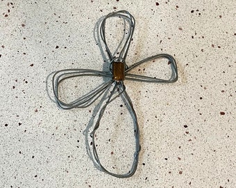 Wire cross with decorative stone in the center