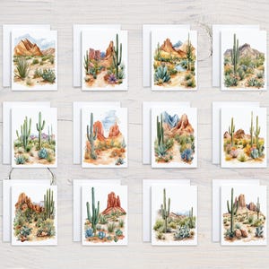 May include: A collection of watercolor greeting cards featuring desert landscapes. Each card showcases a unique scene with cacti, mountains, and desert flora in shades of green, brown, and blue. The cards are paired with white envelopes, creating a cohesive set.