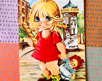 Postal vintage sin usar de los años 70 Big Eyed Girl con su muñeca