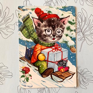 Cadeaux de neige promenade en traîneau avec des chats aux yeux brillants