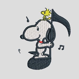 May include: Embroidered design featuring Snoopy and Woodstock. Snoopy, in a musical note shape, holds a black flag. Woodstock sits atop Snoopy's head. Musical notes are scattered around the image. The design is in black, white, yellow, and red.
