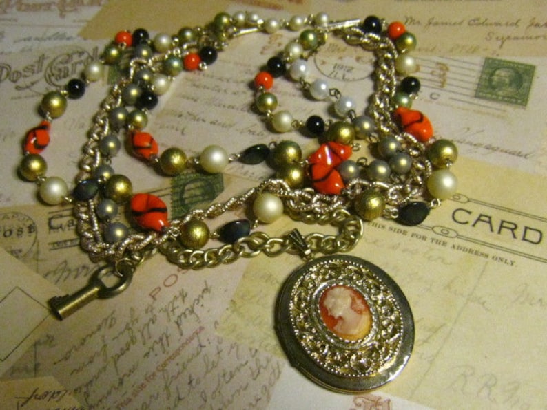 VINTAGE upcycled Timeless Beauty Cameo Locket Assemblaged Multi Stranded Necklace with a brass Skeleton Key