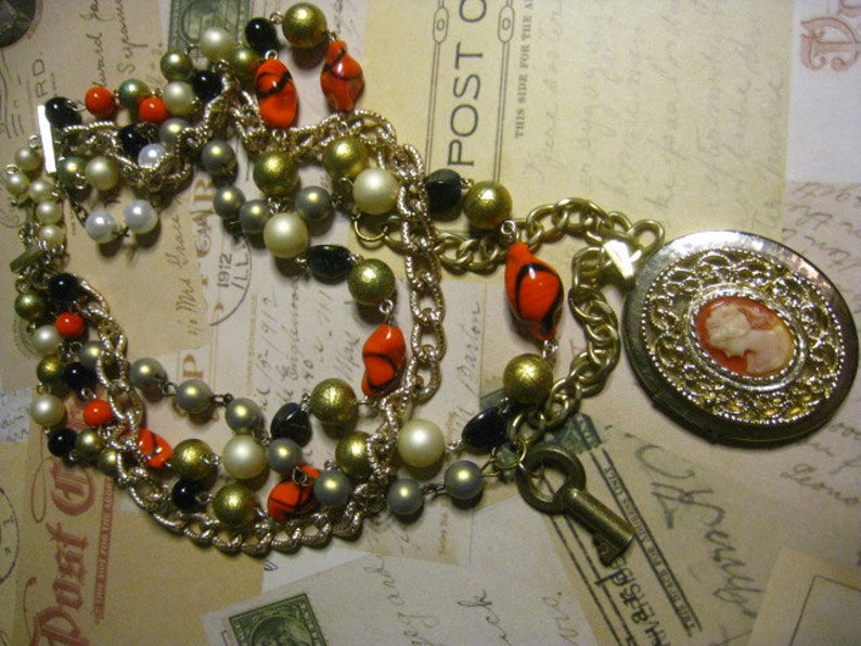 VINTAGE upcycled Timeless Beauty Cameo Locket Assemblaged Multi Stranded Necklace with a brass Skeleton Key
