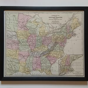 May include: A vintage map of the United States showing the principal connecting lines of railroads. The map is in a black frame and is printed in black, brown, and pink.