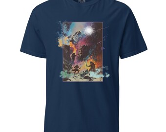 May include: A navy blue t-shirt featuring a graphic print of a fantasy scene. The scene depicts two figures in a snowy landscape with a bright light in the sky. The text "The Lord of the Rings" is printed on the graphic.