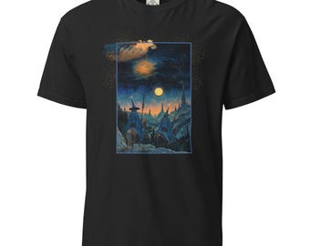 May include: Black t-shirt featuring a graphic print of three figures in blue robes and pointed hats riding horses under a full moon in a dark, starry sky.