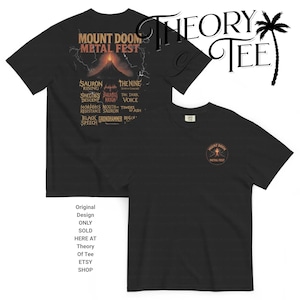 May include: Black t-shirts featuring a Mount Doom Metal Fest design. The front of the shirt has a small circular logo, while the back displays a volcano graphic with band names. Text on the shirt reads "Original Design ONLY SOLD HERE AT Theory Of Tee ETSY SHOP."