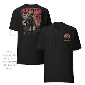 May include: Black t-shirts with a red and beige graphic design. One shirt features a rooster and soldier design on the back, with the word "ROOSTER" above. The other shirt has a rooster head and the word "ROOSTER" on the front.