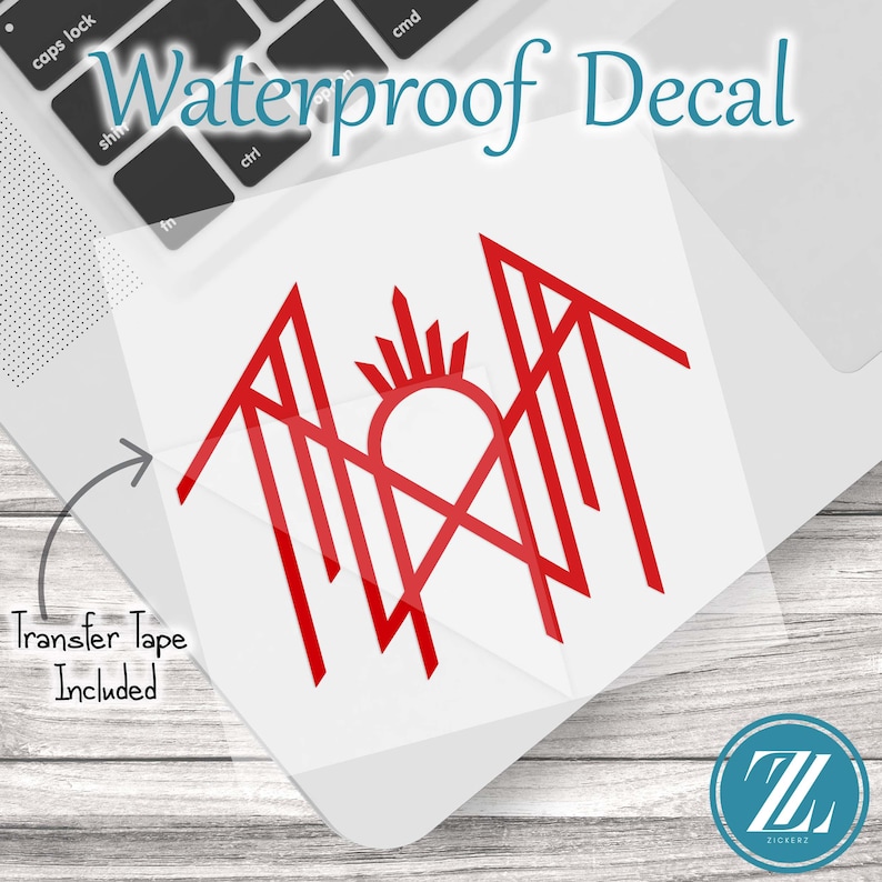 May include: A red waterproof decal featuring a geometric, angular line art design with a central sunburst motif. The decal is presented on a clear backing sheet with the text Waterproof Decal at the top and Transfer Tape Included with an arrow.