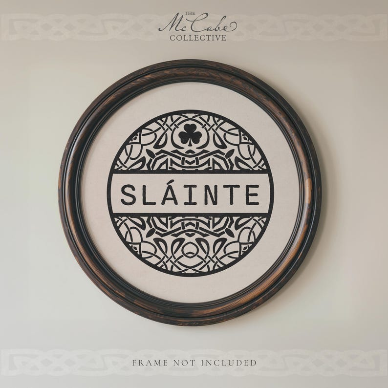 May include: A circular wall art print featuring a black Celtic knotwork design on a cream background. The center displays the word SL&Aacute;INTE in bold black capital letters with a shamrock icon above. The text THE MCCABE COLLECTIVE appears at the top.