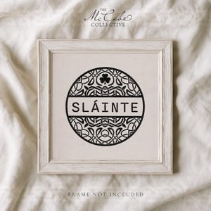 May include: A square print featuring a black circular design with intricate Celtic knotwork and a central shamrock icon. The word SL&Aacute;INTE is printed in a bold, sans-serif font across the middle. The text THE MCCABE COLLECTIVE appears above.