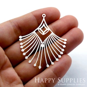 May include: Silver filigree earring pendant with a geometric design. The pendant has a teardrop shape with a pointed top and a fan-shaped bottom.