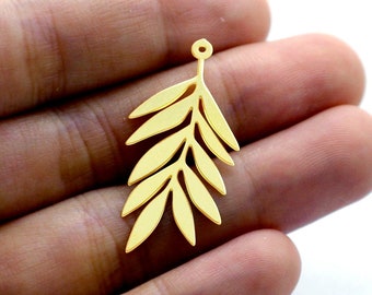 May include: Gold-toned metal leaf charm with a hole at the top for attaching to jewelry. The leaf is detailed with a delicate, intricate design.