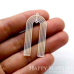 May include: Silver-toned metal earring with a geometric arch design. The arch is made of multiple thin lines, creating a striped effect.