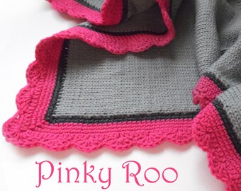 Moderne Babydecke in grau-grundig und anthrazit und pink Umrandung.