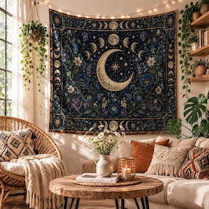 May include: A rectangular wall tapestry featuring a large central crescent moon surrounded by a cycle of moon phases, stars, and intricate blue and purple floral patterns on a dark navy background, framed by a decorative border with corner stars.