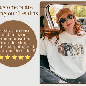 May include: A cream-coloured t-shirt featuring the letters "APRN" in various patterns, including leopard print and checkered designs. The words "Advanced Practice Registered Nurse" are below. The image also includes text that says "Customers are loving our T-shirts".