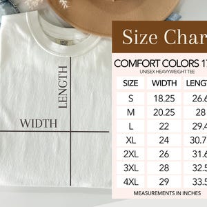 May include: A white Comfort Colors 1717 unisex heavyweight tee shirt with a size chart. The size chart shows measurements in inches for sizes S through 4XL. The shirt is laid flat with lines indicating width and length.