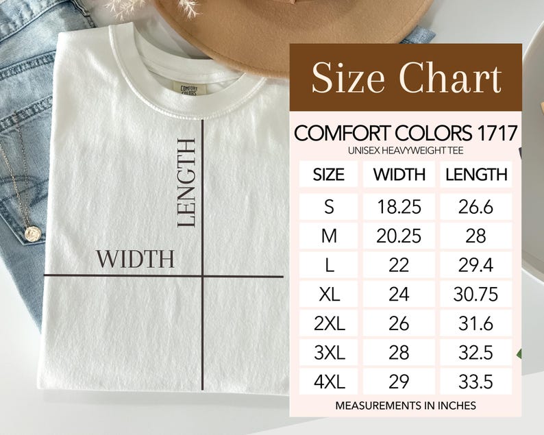 May include: A white Comfort Colors 1717 unisex heavyweight tee shirt with a size chart. The size chart shows measurements in inches for sizes S through 4XL. The shirt is laid flat with lines indicating width and length.