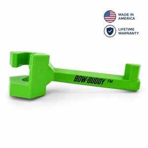 May include: A bright lime green Bow-Buddy tool featuring a specialized hook and clamp design for archery equipment. The side of the tool is clearly printed with the text BOW-BUDDY TM. Above the tool, circular icons indicate Made in America.