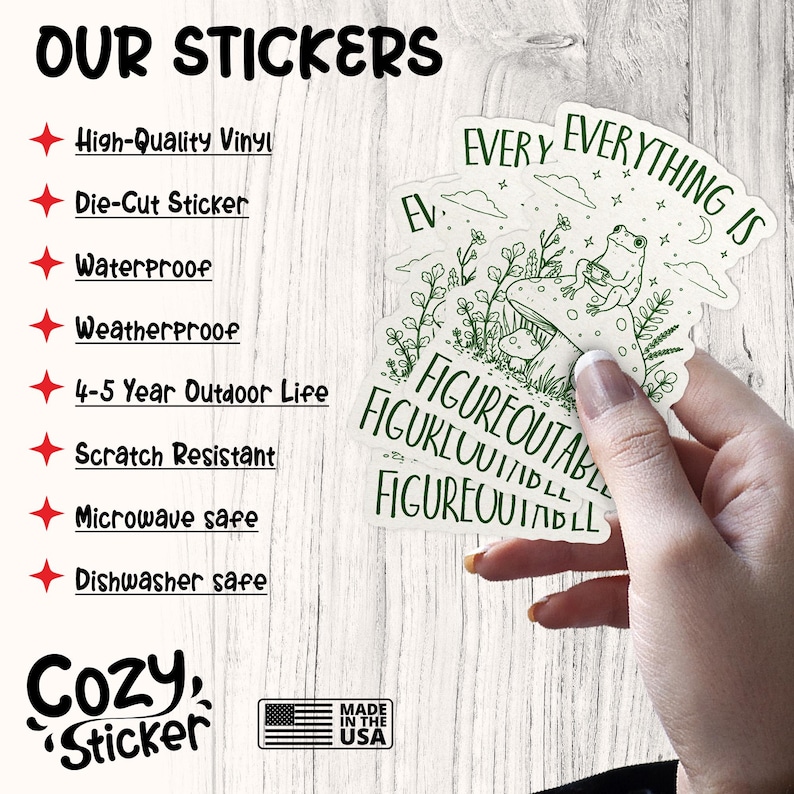 May include: A hand holds several white stickers with green illustrations of a frog on a mushroom and the text "EVERYTHING IS FIGUREOUTABLE". The image also shows text that says "OUR STICKERS" and lists features like "High-Quality Vinyl" and "Waterproof".
