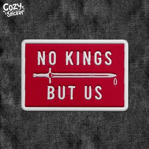 May include: Red embroidered patch with white stitching. The patch features a sword and the text "NO KINGS BUT US".
