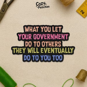 May include: Embroidered patch with the text "WHAT YOU LET YOUR GOVERNMENT DO TO OTHERS THEY WILL EVENTUALLY DO TO YOU TOO." The patch has a black border and colourful text. The brand name "Cozy Patches" is at the top.