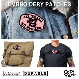 May include: Pink and black embroidered patch with the text "ALL TRASH NO TRAILER" and a raccoon illustration. The patch is displayed on a denim jacket, a messenger bag, and a tactical vest. The image also includes the words "UNIQUE EMBROIDERED" and "DURABLE".
