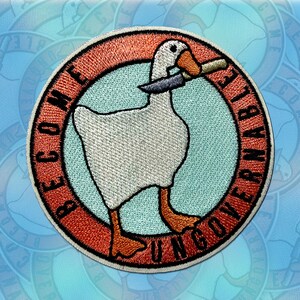 May include: A white goose with an orange beak holding a knife in its beak. The goose is on a blue background with a red circle around it. The circle has the text "Become Ungovernable" written around it.