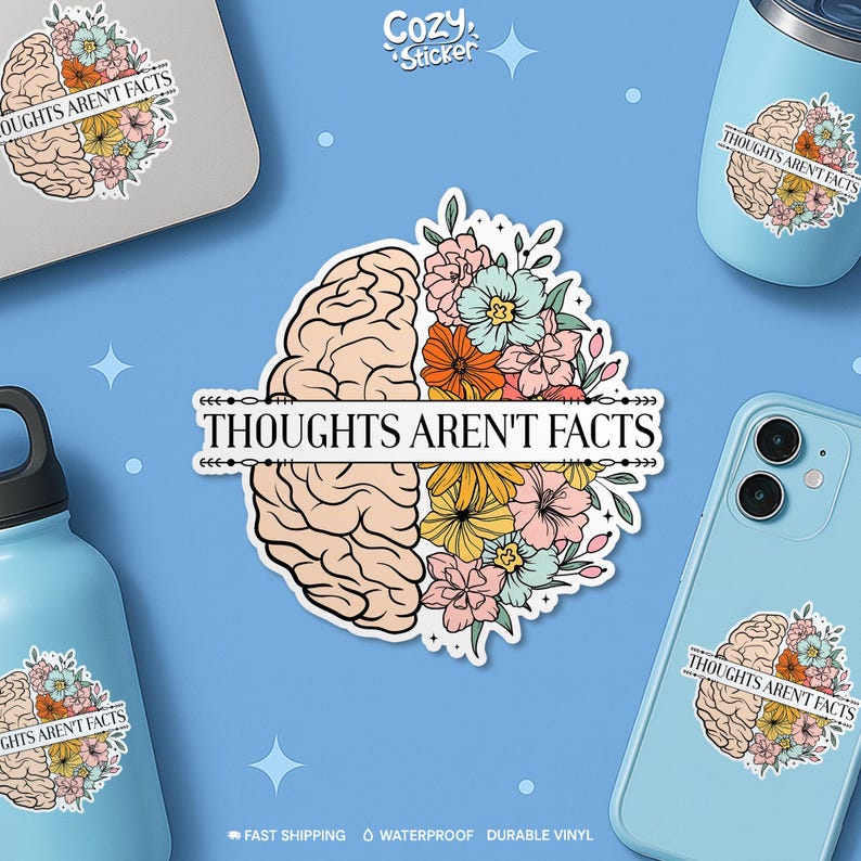 May include: A sticker design featuring a brain split in half, with one side floral and the other a brain. The text "THOUGHTS AREN'T FACTS" is centered. The sticker is displayed on a laptop, tumbler, phone, and water bottle.